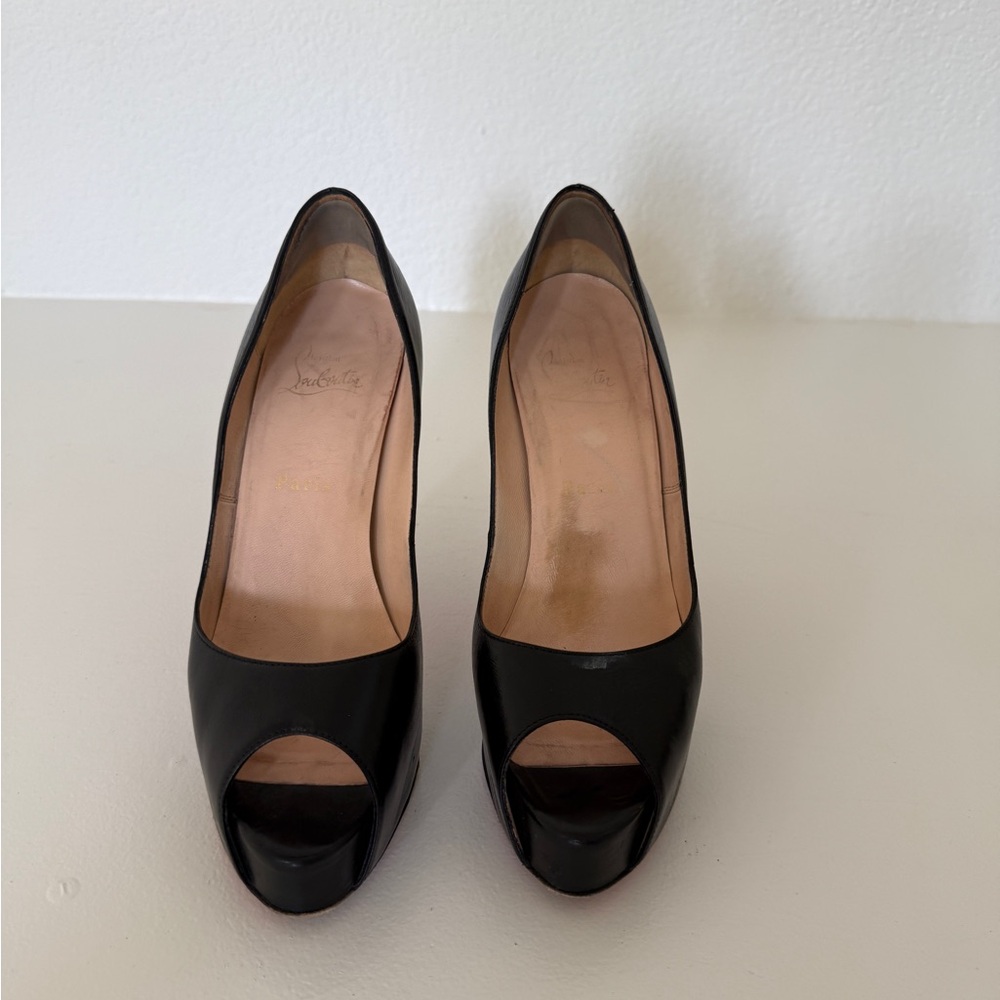 Christian Louboutin Peep toe, platform pumps. Black leather in good condition.
